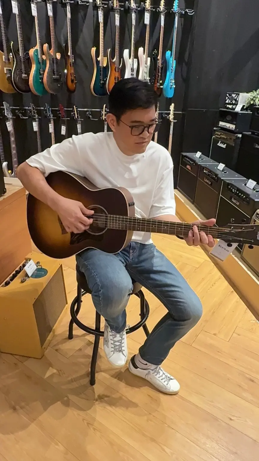 Tender Echo musician playing an acoustic guitar