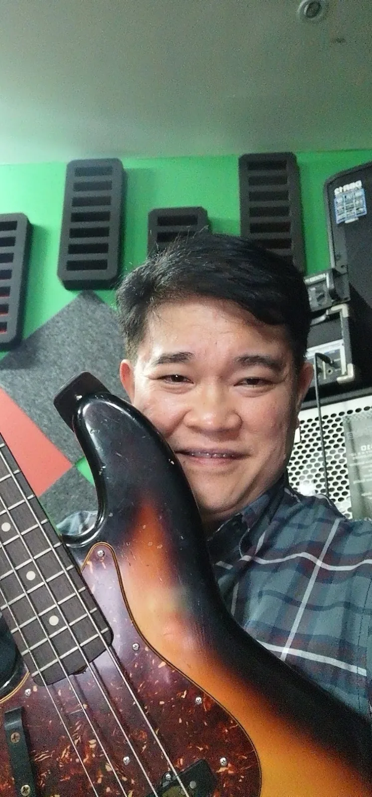 Musician with sunburst bass guitar
