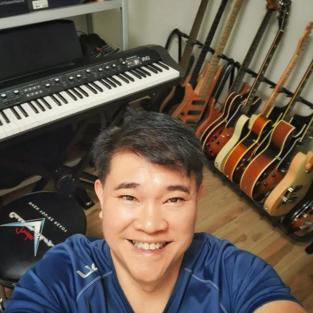 In the studio surrounded by guitars and keyboards